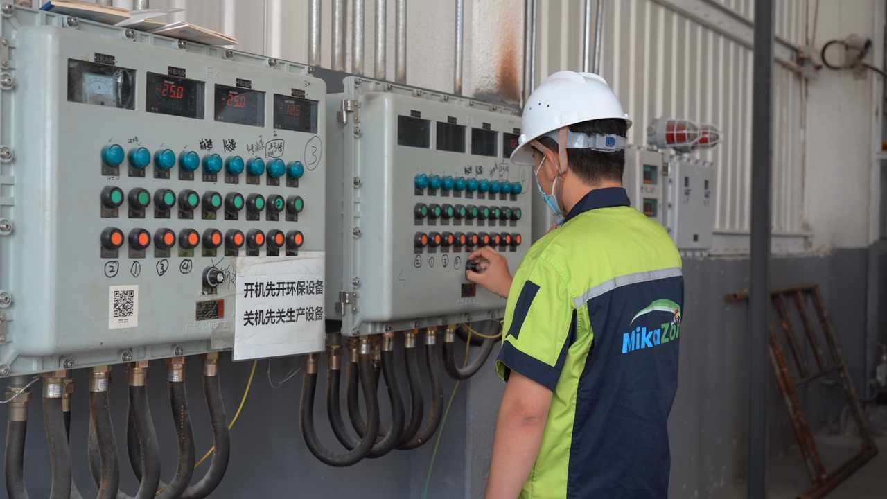 Construction site worker applying building materials on wall