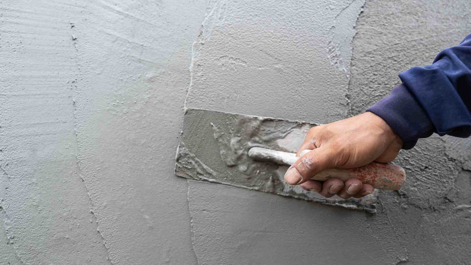 Waterproof mortar application on building surface for moisture resistance and protection