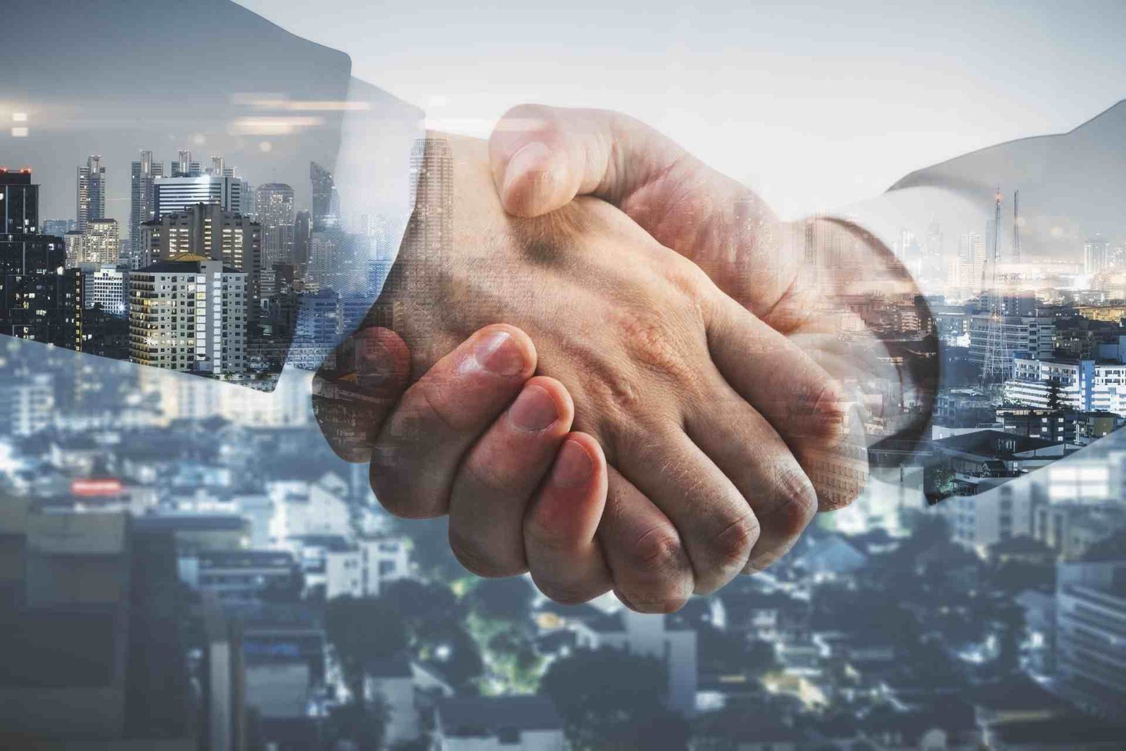 Business partnership handshake
